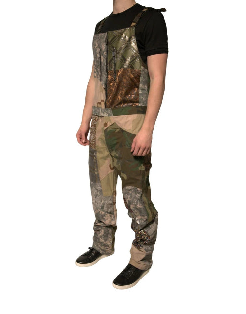 Camouflage hunting bib overalls worn by a person on a white background