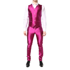 Person wearing a bright pink suit with a white shirt on a white background