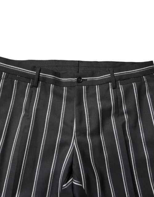 Black pinstripe pants with a button on a white background