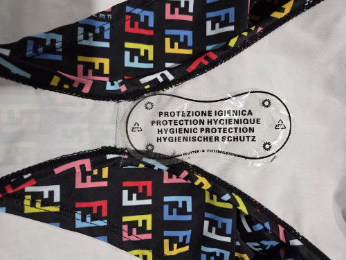 Multicolored patterned fabric with a hygiene protection label on a white background