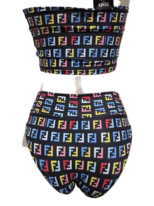 Colorful patterned bikini on a mannequin against a white door background