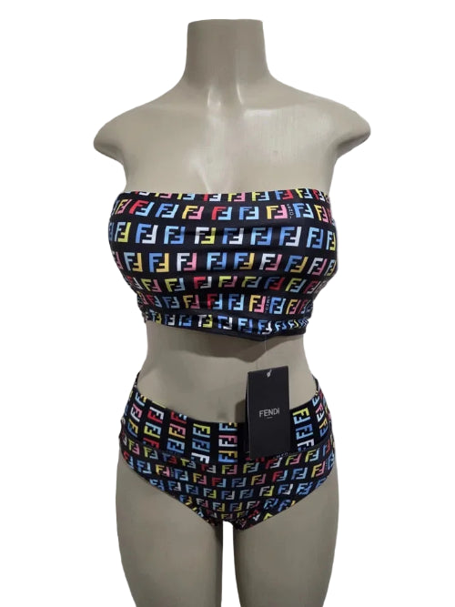 Bikini set with colorful pattern on a mannequin against a white door background