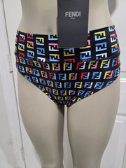 Fendi logo swim briefs on a mannequin with Fendi branding.