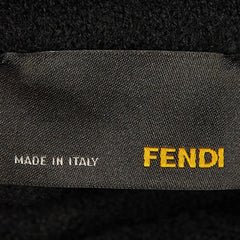 Fendi label on a textured black background