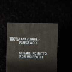 Text label on fabric with care instructions and material information.