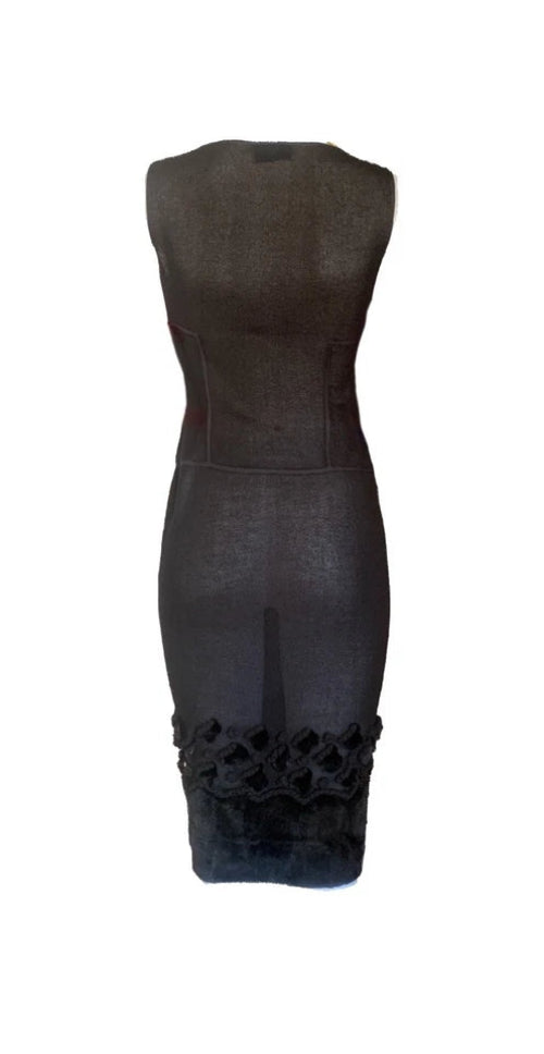 Black dress with floral cutouts on a white background