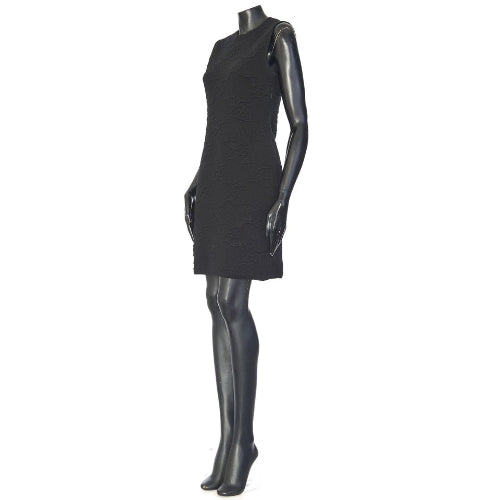 Black dress on a mannequin against a white background
