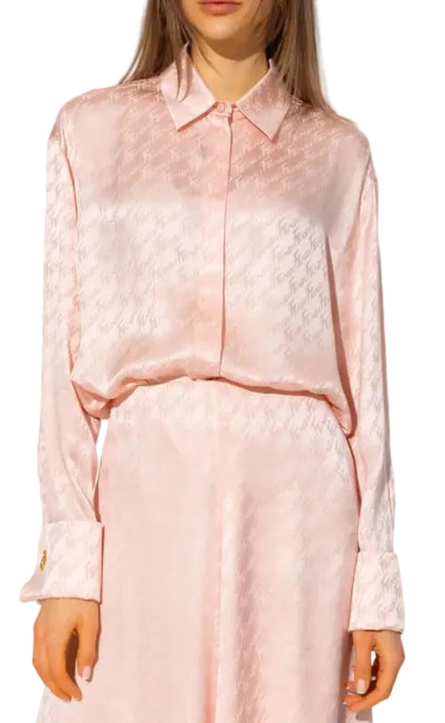 Light pink blouse with sheer details worn by a person