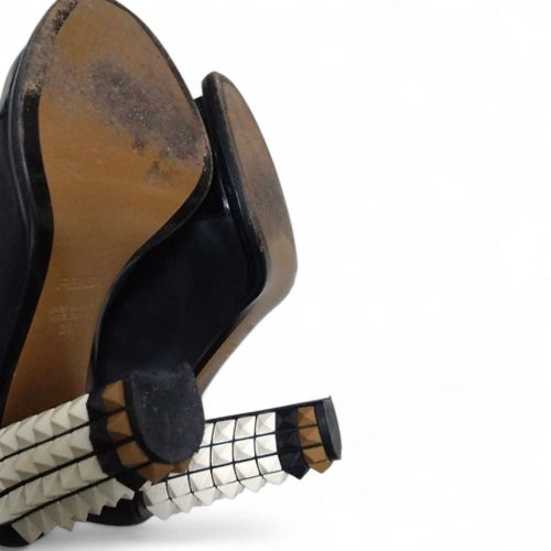 Close-up of a worn leather shoe with a white background