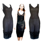 Black dress with lace details on a model against a blurred background