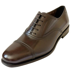 A dark brown leather lace-up dress shoe with a cap toe and polished finish, shown from a three-quarters angle on a white background.