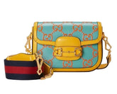 Colorful handbag with decorative patterns on a plain background