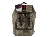 Gucci backpack with monogram pattern on a white background