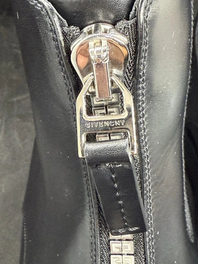 Close-up of a Givenchy zipper on a black leather product
