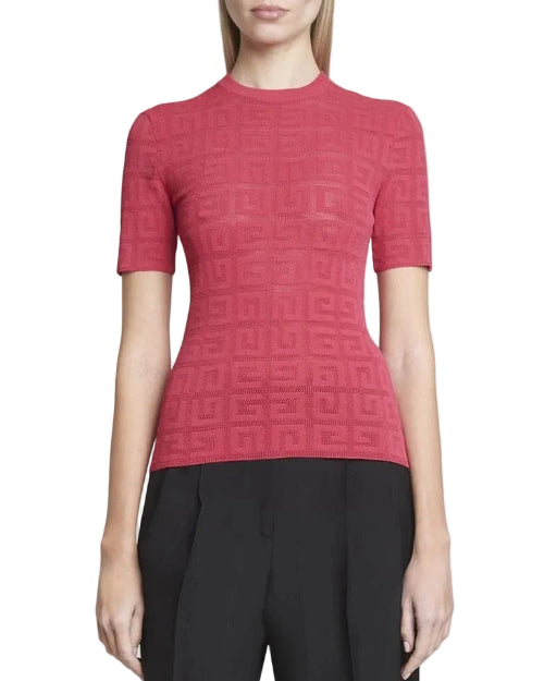 Red textured top worn by a person, with black pants, on a plain background
