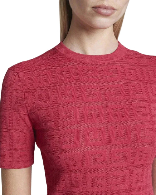Red textured dress worn by a person on a white background