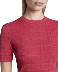 Red textured dress worn by a person on a white background