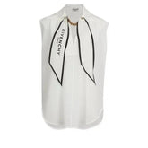 White sleeveless blouse with black accents and Givenchy branding on a white background