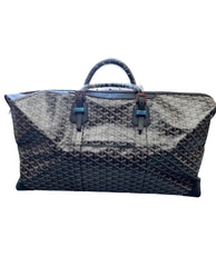 A dark navy blue woven leather tote bag with a top handle, shown against a plain white background.