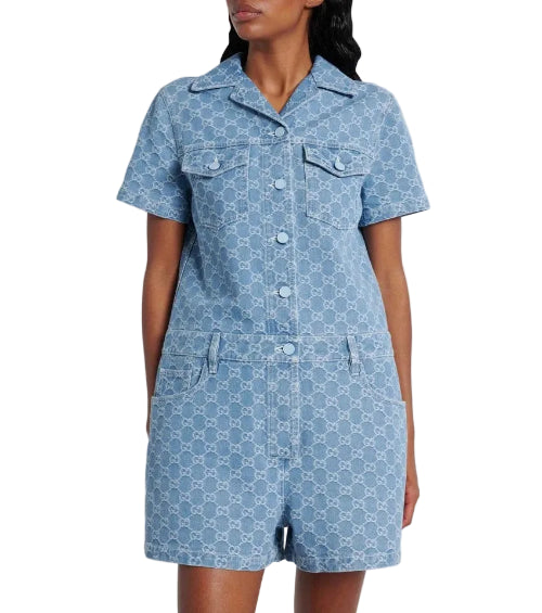 Woman wearing a blue polka dot dress with a white background