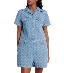Woman wearing a blue polka dot dress with a white background