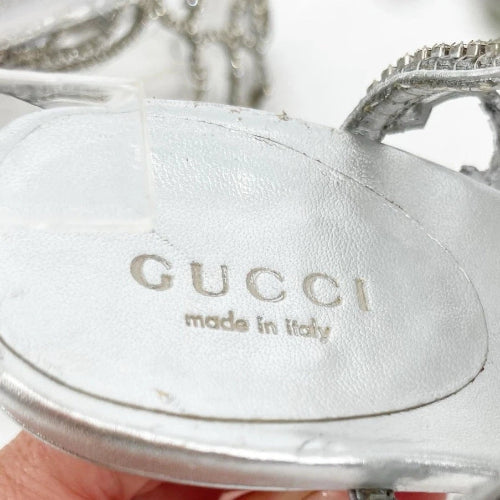 Gucci logo on a silver product with 'made in Italy' text