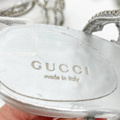 Gucci logo on a silver product with 'made in Italy' text
