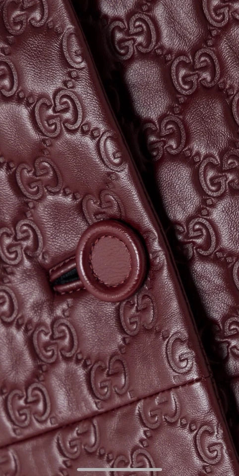Close-up of a brown textured fabric with a button