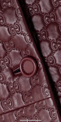Close-up of a brown textured fabric with a button