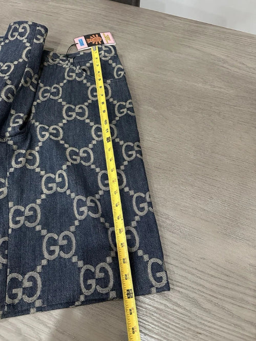 Measuring tape on a surface with a patterned fabric background