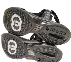 Black and gray sandals with brand logo on a white background