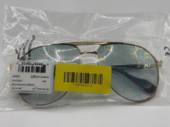 Gold and black Gucci sunglasses in packaging with a yellow tag and barcode.