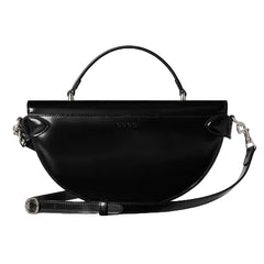 Black handbag with a strap on a white background
