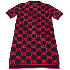Black dress with red pattern on a light gray background