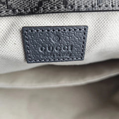 Close-up of a Gucci logo on a product with a blurred background