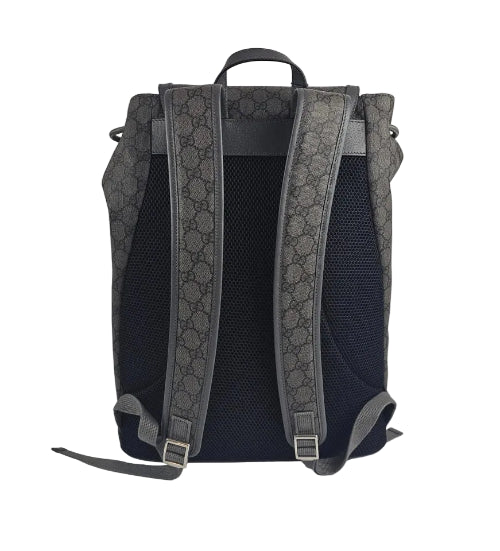 Backpack with patterned straps on a light gray background