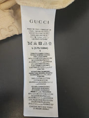 Gucci label on a garment with text and branding.