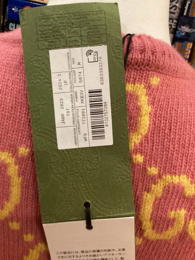 Product tag with a barcode on a pink textured surface