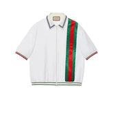 White jacket with red and green striped accents on a light gray background