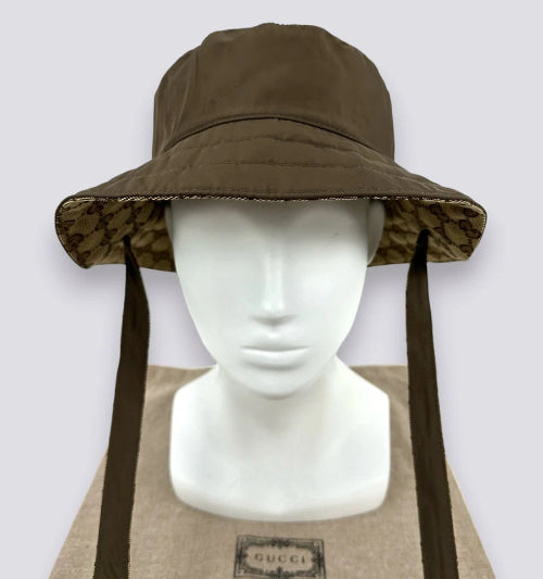 Brown wide-brimmed hat with neck flap on a mannequin head