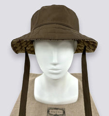 Brown wide-brimmed hat with neck flap on a mannequin head