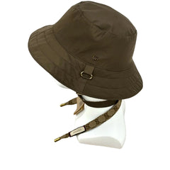 Brown bucket hat with a strap on a mannequin head against a white background