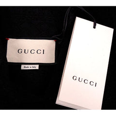 Gucci label and packaging on a black background