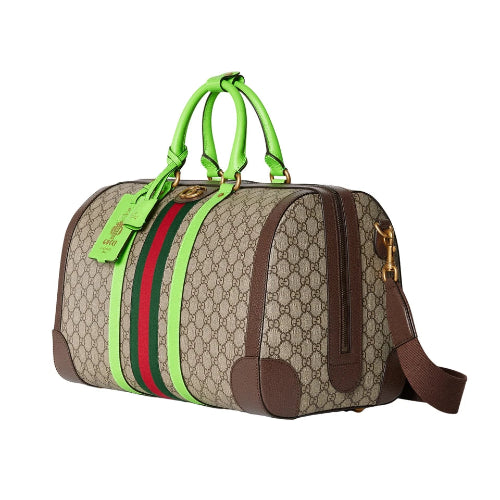 Designer bag with green handles and red and green stripes on a white background