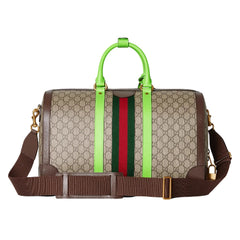Designer bag with green handle and red and green stripes on a white background