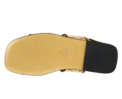 Back view of a sandal with Gucci logo on a white background