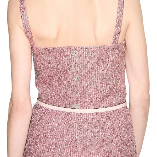 Pink textured dress with thin straps on a neutral background