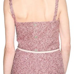 Pink textured dress with thin straps on a neutral background