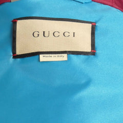 Gucci label on a blue fabric background