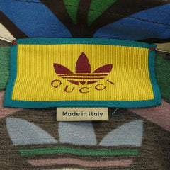 Gucci label on a multicolored fabric background